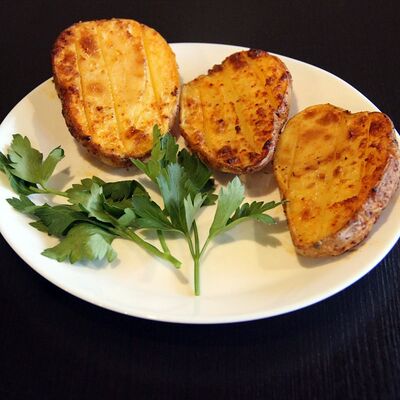 Картофель запеченный в Наш дворик по цене 255 ₽