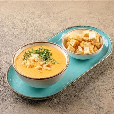 Сырный крем суп с креветками в У рыбака по цене 650 ₽