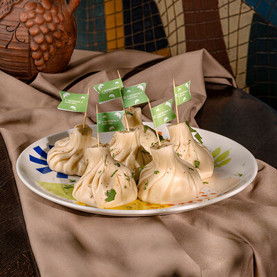 Хинкали с цыпленком и сулугуни в Аджикинежаль по цене 155 ₽