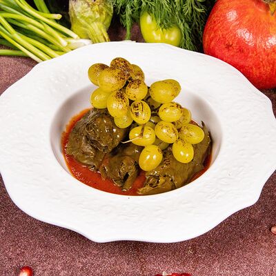 Долма с бараниной и запеченным виноградом в томатном соусе в Чичилаки по цене 750 ₽