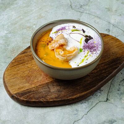 Тыквенный крем-суп с креветками в Moloko по цене 520 ₽