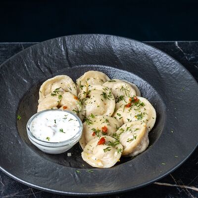 Пельмени с креветкой в сливочном соусев Метро Cafe по цене 539 ₽