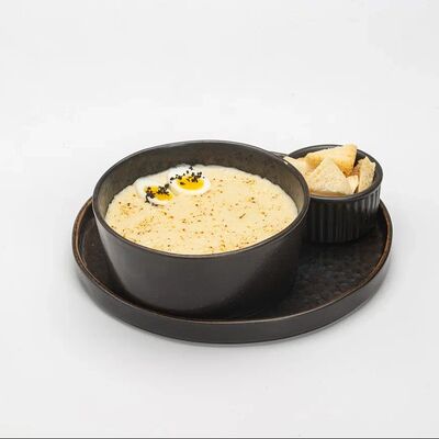 Крем-суп картофельный с пармезаном в Le dessert по цене 690 ₽