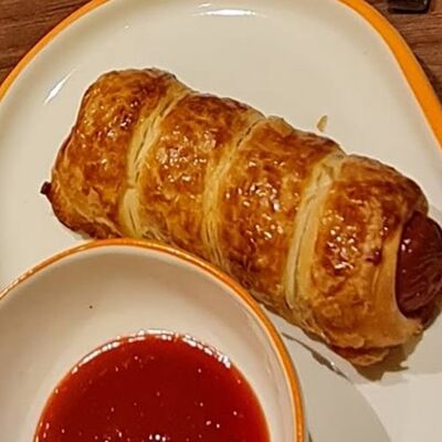 Сосиска в тестев Шаурма на просвященской по цене 120 ₽