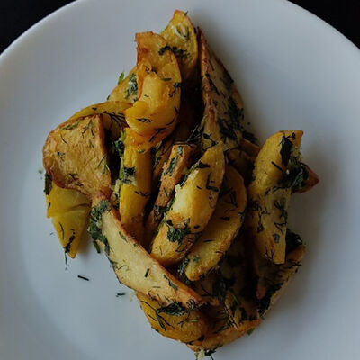 Картофель по-деревенски в Джон Вкусный по цене 9400 ₽