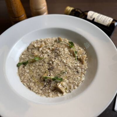 Ризотто с белыми грибами и трюфельным кремом в PizzAmore по цене 1240 ₽