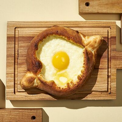 Хачапури Аджарули в Хачапури и вино по цене 284 ₽