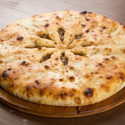 Осетинский пирог с мясом в Узбекская кухня по цене 690 ₽