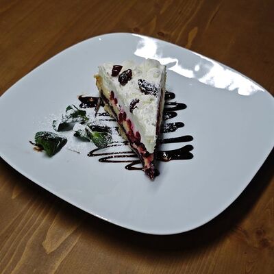 Торт брусничный с белым шоколадом в ATLAS BY CUISINE по цене 490 ₽