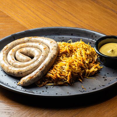 Мюнхенская колбаска на гриле с тушеной капустой и дижонской горчицейв Brasserie Lambic по цене 870 ₽