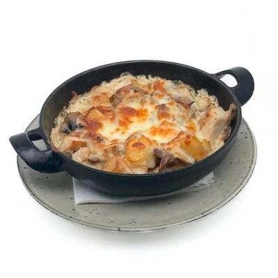 Картофель по-деревенски с мясом в Garage по цене 660 ₽