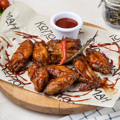 Куриные крылья в соусе BBQ в Коломан по цене 460 ₽