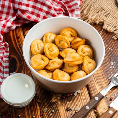 Пельмени жареные со сметанойв Toro burger по цене 289 ₽