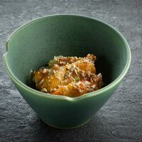 Бананы в кляре с соленой карамелью и миксом орехов в Ikigai