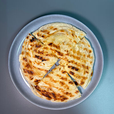 Лепешка Roti c сыром в Парнас по цене 300 ₽