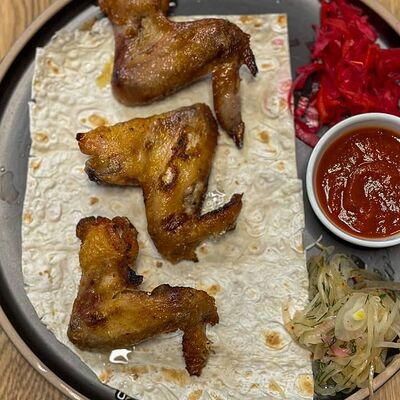 Куриные крылышки в ШашлычОк по цене 290 ₽