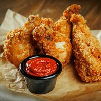 Куриные крылья в панировке в Мясорубка Angus