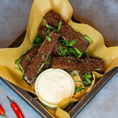 Гренки чесночные в Brizola BBQ по цене 250 ₽