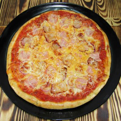 Пицца С беконом и ветчиной в Rioz pizza по цене 390 ₽