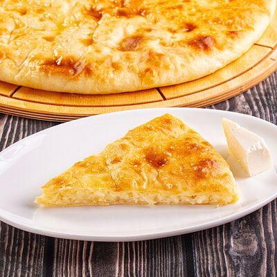 Осетинский пирог с сыром в Осетинские Пироги по цене 1250 ₽