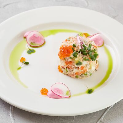 Салат Оливье с копчёным лососем и красной икрой в Four по цене 680 ₽