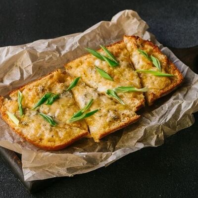 Гренки с чесноком и сыром в PANORAMA по цене 480 ₽