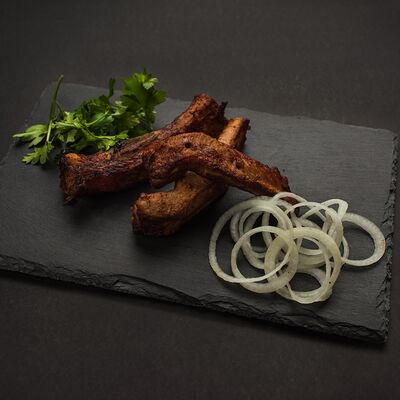 Шашлык из свиных ребрышек в Шашлычный дворик по цене 480 ₽