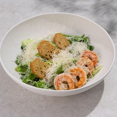 Салат Цезарь с креветками в Delicates Club по цене 1140 ₽