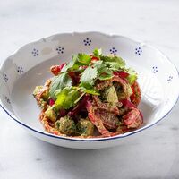 Салат по-грузински с соусом сациви в Padre Khinkali