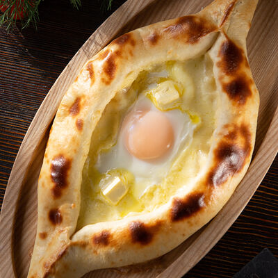 Хачапури по-аджарски в Хинкальная Сациви по цене 630 ₽