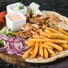 Гирос на тарелке с курицей в Mangal Doner по цене 583