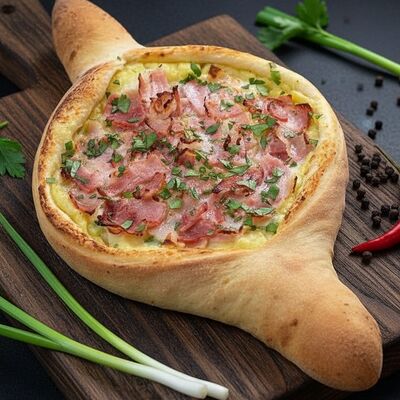 Хачапури по-Аджарски с хрустящим беконом и картошечкой в Аджапури по цене 550 ₽