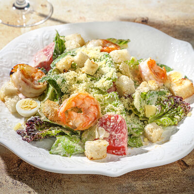 Салат Цезарь с креветками в Ива по цене 1160 ₽