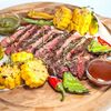 Рибай на гриле с овощами и соусами BBQ и Песто в Mama Roma по цене 1194