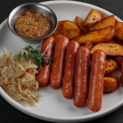 Колбаски пряные с сыром и картофелем Айдахо в По Чесноку по цене 662 ₽