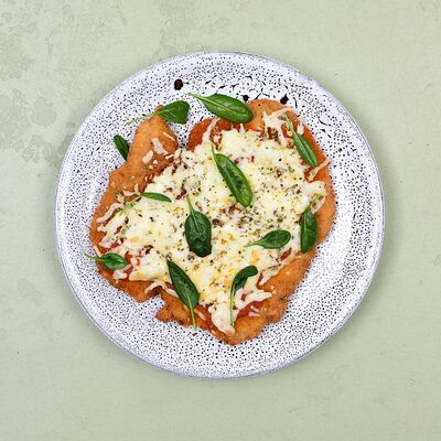 Шницель из телятины с томатным соусом и моцареллой в Пармезан и пури по цене 420 ₽