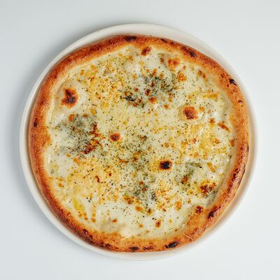 Пицца Четыре сыра в Everland по цене 1090 ₽