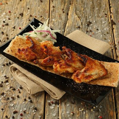 Куриные крылья на мангале в Шашлык мечты Красноярск по цене 495 ₽