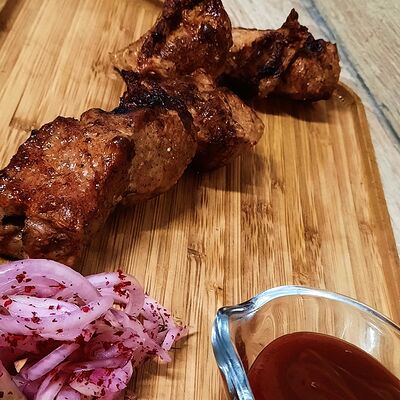 Шашлык из свиной шеив Mangal house по цене 630 ₽