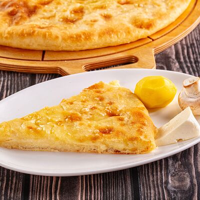 Пирог с сыром, картофелем и грибами в Осетинские Пироги по цене 1250 ₽