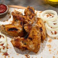 Шашлык из куриных крылышек на углях в Форель