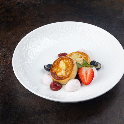 Сырники с творожно-сметанным соусом в Город детей по цене 510 ₽