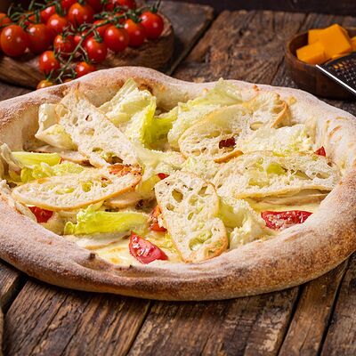 Цезарь пиццав Дом пиццы по цене 650 ₽