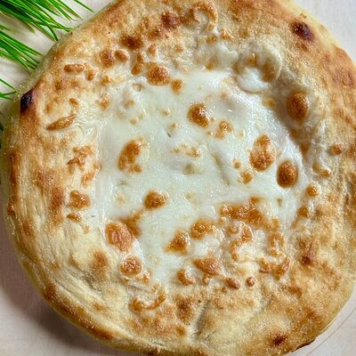 Осетинский пирог с ветчиной, яйцом и сыром в Уфтанма по цене 649 ₽