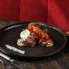 Медальоны из говядины с цукини, черри и грибным дюкселем в Kinza по цене 1090