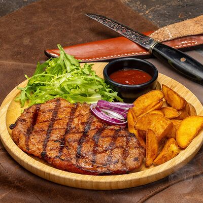 Стейк из cвинoй шеи в Gastroli Grill по цене 1090 ₽