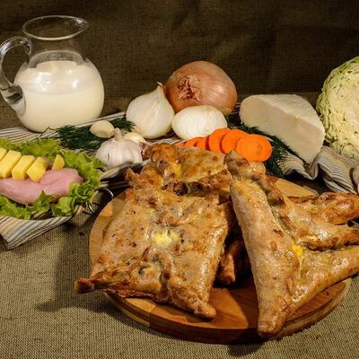 Чукуры с минтаем и картофелем в молоке в Пироги по-коми по цене 1268 ₽