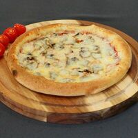 Ветчина, грибы, помидоры в Bаiano - pizza