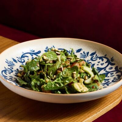 Зелёный салат с томатами и кремом из трав в NANA Pirveli по цене 750 ₽