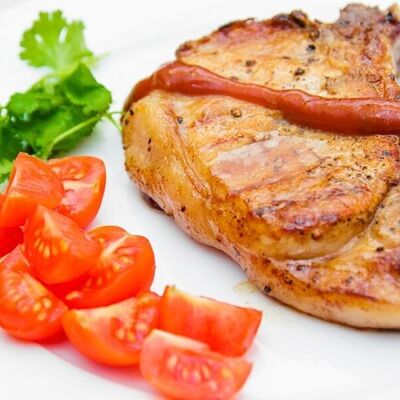 Свиная отбивная в Панорама по цене 620 ₽